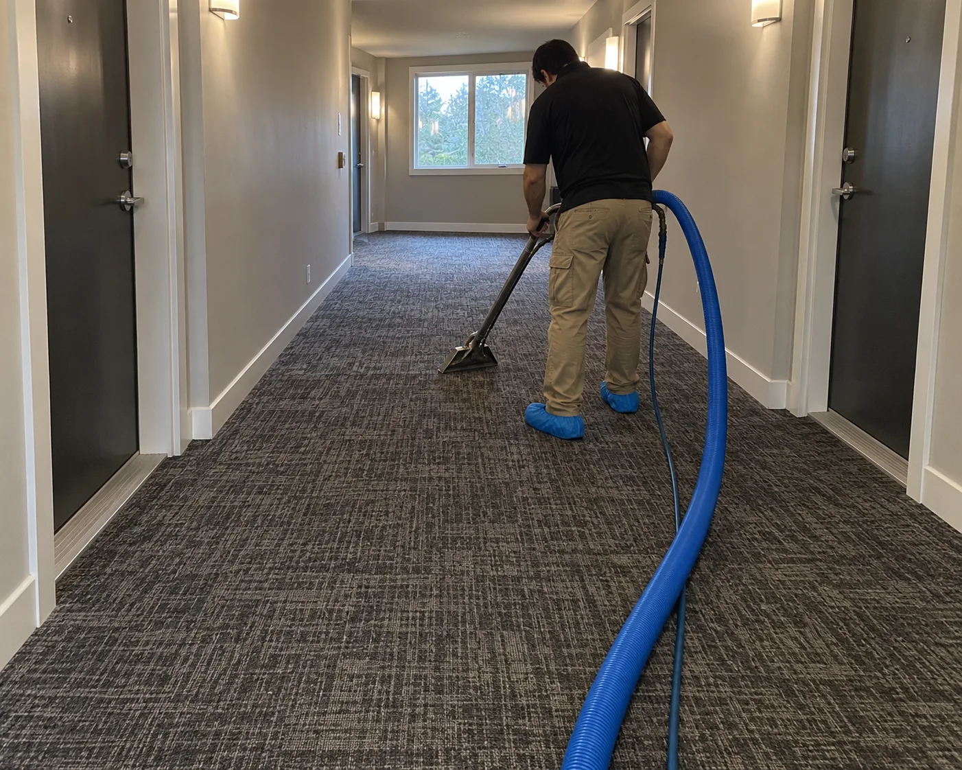 Cleaning a shared carpeted hallway